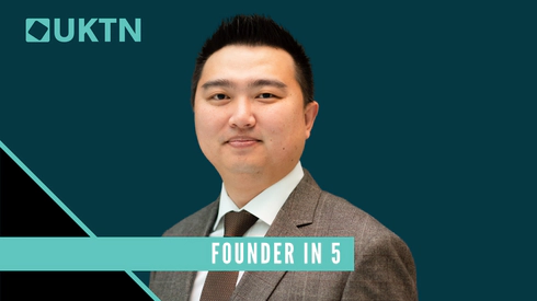 A picture of Transreport founder Jay Shen wearing a grey suit, in front of a dark turquoise and black plain background. The top left of the image has the UKTN logo in light turquoise colour, and a light turquoise banner spans the image at the bottom reading 'Founder in 5'.