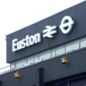 A white sign on a black background reading Euston from the Euston train station.
