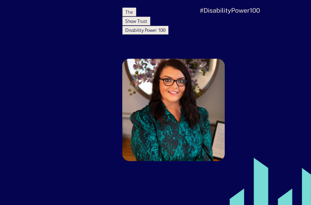 Transreport’s Emma Partlow Named as One of the Most Influential Disabled People in 2024 Disability Power 100 Photo of Emma Partlow, a white woman with long dark brown hair, brown glasses and a blue patterned dress. Emma is smiling in front of purple orchids. Above the photo text reads "The Shaw Trust Disability Power 100" in blue font in cream boxes, with the Disability Power 100 hashtag top right and two teal Transreport pillars bottom right. Navy blue background with cream text. NEW
