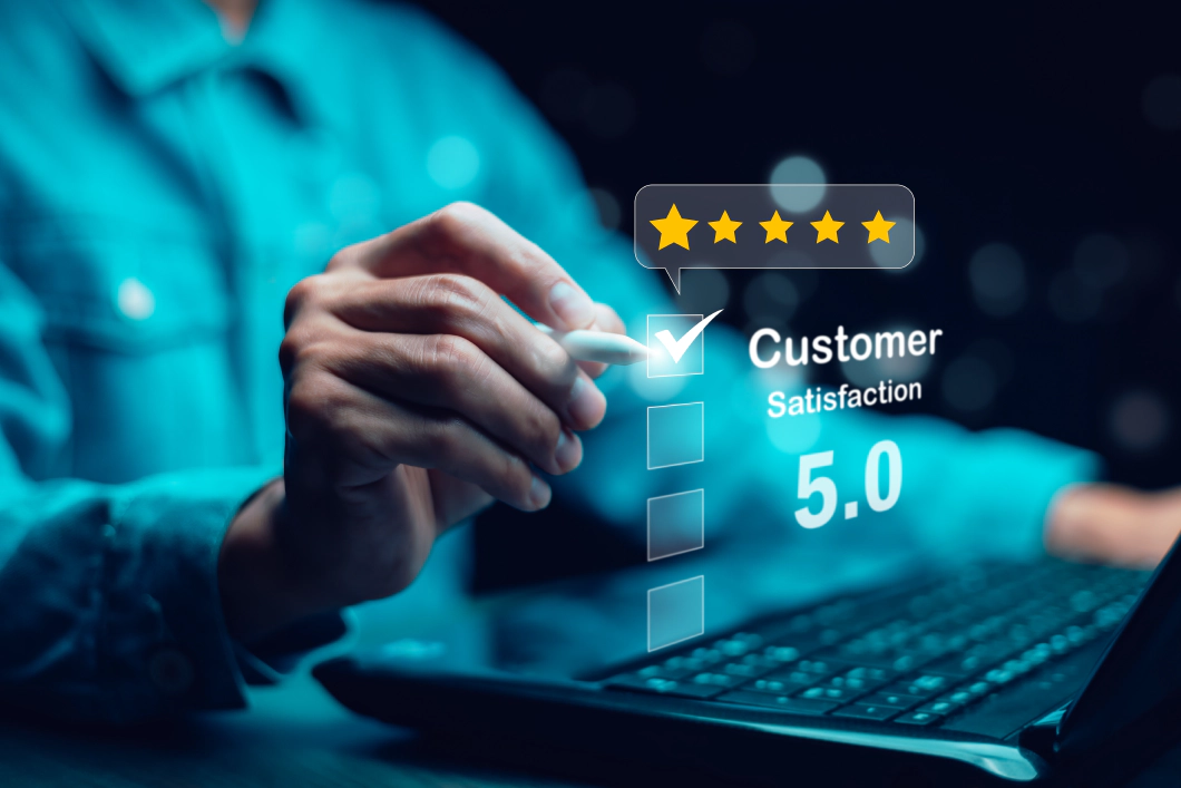 Person using a stylus to give a 5-star customer satisfaction rating on a digital interface, with a visible score of 5.0.