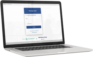 A laptop computer showing the Passenger Assistance Staff Web Platform login page.